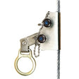 Close-up of the DBI-SALA Static Wire Rope Grab for 3/8 in. Steel Cable (Model 5000338) from 3M DBI-SALA Fall Protection, a critical component of an integrated fall protection system, secured to a vertical cable. The device incorporates a chain, a circular handle, and two screw bolts with blue centers. Engineered like a static wire rope grab, it ensures safety in climbing applications while complying with OSHA standards.