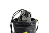 The Python Safety Vinyl Safe Bucket with Drawstring 1500139 by 3M DBI-SALA Fall Protection includes a black drawstring bag securely closed and partially encased in a larger black duffle-style bag featuring yellow accents. The top bag is cinched tightly, while the larger bag showcases a subtle yellow logo on the side, offering a stylish solution to safely carry your essentials.