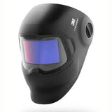 The 3M Speedglas Welding Helmet G5-02 Complete Helmet Assembly is a black helmet that boasts a large, curved auto-darkening filter with 3M Speedglas Technology, providing a blue tint. Its design features a logo and has a smooth, curved surface to ensure complete head coverage.