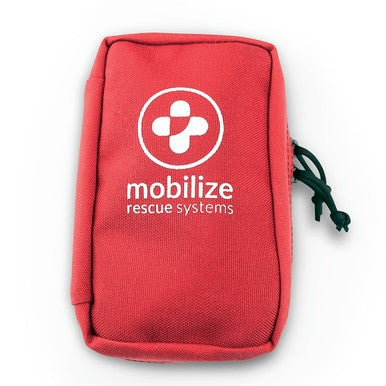 A compact red ZOLL Mobilize Utility Rescue System 8911-004000-01 with the "Mobilize Rescue Systems" logo and text in white on the front. It features a prominent white cross symbol and complements the Mobilize Rescue app. Equipped with a zipper and a green pull cord on the side, this essential medical equipment is ready for action.