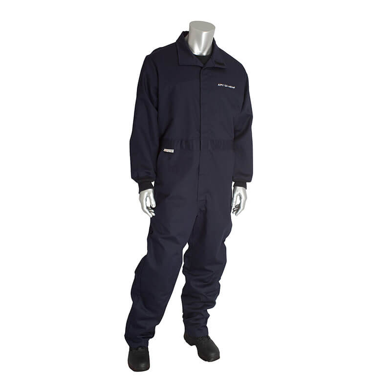A metallic mannequin is dressed in a PIP Navy 8.5 Cal Dual Certified ARC/FR Coverall 9100-2160D with long sleeves, full-length pants, and a collar. This NFPA 2112-rated outfit is paired with black shoes, and the mannequin is standing to display its protective gear.