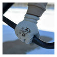 Someone wearing MCR Safety Memphis Flex-Therm Glove 9690 from MCR Safety firmly grips a black metal bar outdoors, with snow and a blurred background in view—demonstrating the crucial protection and warmth these cold weather work gloves provide.