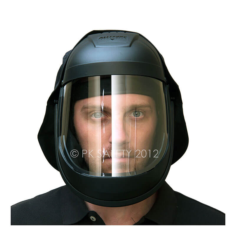 A person is wearing a PK Safety Supply Allegro Economy Supplied Air Face Shield, which features a clear visor for head and face protection. The helmet appears sturdy and is complemented by a black shirt against a plain, unobtrusive background.