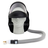 The Allegro Economy Supplied Air Face Shield with Low Pressure Adapter by Allegro is shown on a mannequin head, featuring a clear shield, black visor, fabric shroud, and a long hose ending in a connector.