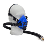 An Allegro Half Mask Constant Flow Airline Respirator 9920 from PK Safety Supply is fitted on a mannequin head, featuring a blue half-mask with an attached hose. The hose, engineered for continuous airflow, ends with a metal connector to attach to an air supply. The mask includes adjustable straps and a silicone facepiece for a secure fit.