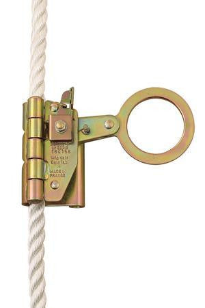 Close-up of the Protecta AC202D COBRA Auto or Manual Rope Grab, a metallic pulley component from 3M DBI-SALA Fall Protection. The device, often utilized in full body fall protection systems, features a circular opening and a gold-colored finish with engraved text on its side, indicating its use as part of industrial safety equipment.