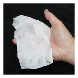 A hand holds a crumpled white tissue against a black background, symbolizing protection from environmental allergens with Coretex IvyX Pre-Contact.