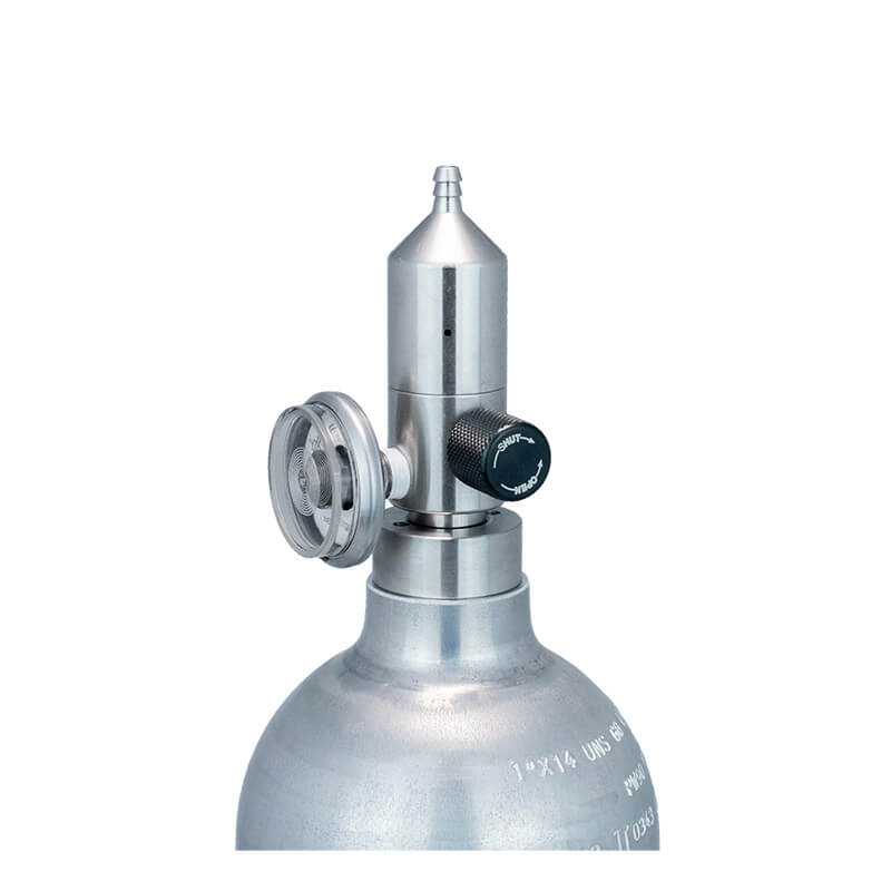 The WatchGas Fixed Flow Regulator Stainless Steel 0.5 LPM sits atop a silver medical oxygen cylinder, featuring a stainless steel pressure regulator and valve to ensure gas flow accuracy for reliable delivery, all shown isolated on a white background.