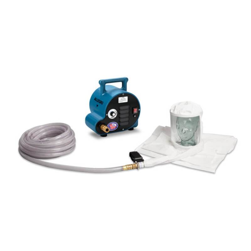 A compact Allegro water pump from the Allegro Worker Double Bib Hood Cool Air System 9222-0_A, featuring a blue finish and handle, is connected to a coiled transparent hose. The hose leads to a white Tyvek hood, which is open at the top and placed on a flat surface. The pump is adorned with a sticker displaying a flag.