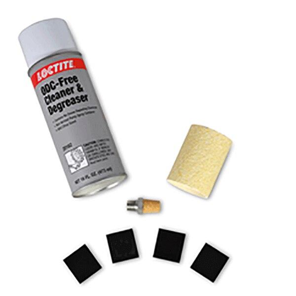 An open can of Loctite ODC-Free Cleaner & Degreaser is lying beside a foam cylinder, a small metal component, and five black square pieces arranged in a semi-circle—essential components of the Allegro Service Kit for maintaining ambient air pumps.