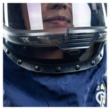 Close-up of a person wearing the NSA Enespro ArcGuard Performance 40 Cal Lift Front Hood ARC40H, featuring a dark helmet, clear visor, and blue padded arc flash clothing with buttons and a hint of yellow emblem.