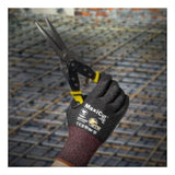 A gloved hand wearing PIP MaxiCut Ultra Nitrile MicroFoam A6 Gloves 44-6745F holds metal snips at a construction site, with steel reinforcing bars visible in the background.