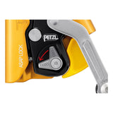 Close-up of the Petzl ASAP LOCK B071BB00 by Petzl, featuring its locking mechanism with "LOCK" and arrow labels on the silver lever, set against a striking yellow and black background to emphasize optimal rope safety.