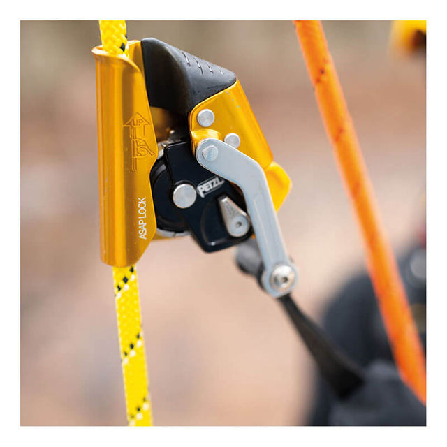 Close-up of the Petzl ASAP LOCK B071BB00 by Petzl, a yellow and black fall protection device attached to a yellow climbing rope, ensuring rope safety during rope access or climbing activities.