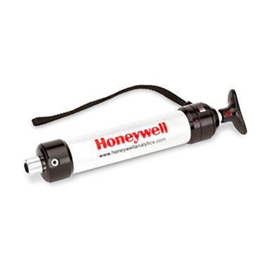 A white BW Honeywell Piston Hand Pump with black ends and a black hand strap, featuring "www.honeywellanalytics.com" in bold red text across the body.