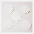 Five circular filters from the BW Honeywell Pump Hydrophobic Filter Replacement XT-RF-H5 pack are arranged on a plain, light surface, showcasing a clean efficiency reminiscent of Honeywell's renowned hydrophobic filter technology.