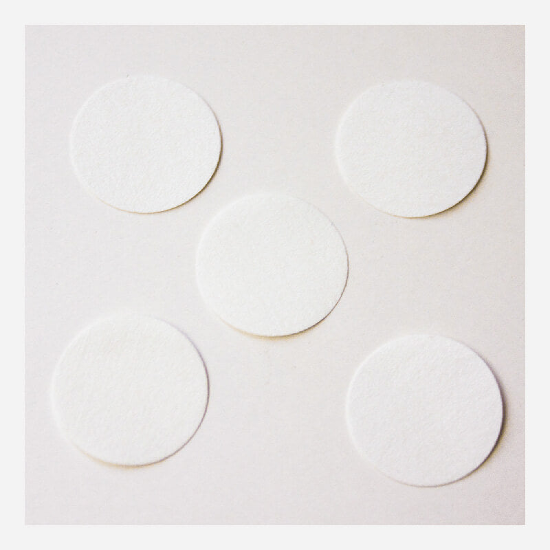 Five circular filters from the BW Honeywell Pump Hydrophobic Filter Replacement XT-RF-H5 pack are arranged on a plain, light surface, showcasing a clean efficiency reminiscent of Honeywell's renowned hydrophobic filter technology.