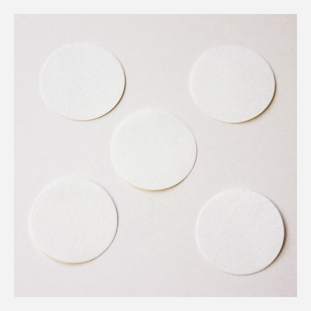 Five circular filters from the BW Honeywell Pump Hydrophobic Filter Replacement XT-RF-H5 pack are arranged on a plain, light surface, showcasing a clean efficiency reminiscent of Honeywell's renowned hydrophobic filter technology.