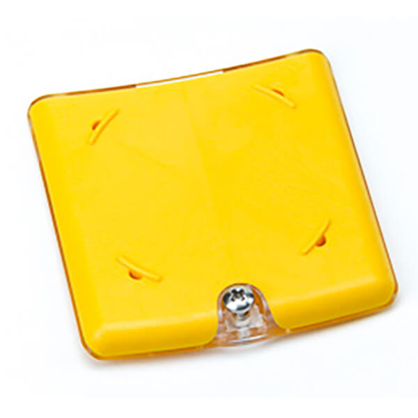 A yellow reflective road stud with a clear center reflector, designed for road marking to enhance visibility, just like the BW Honeywell Max XT II Replacement Sensor Enclosure enhances safety by incorporating advanced features.
