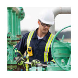 A worker in a white hard hat, safety glasses, gloves, and a reflective vest adjusts green pipes outdoors. A BW Technologies by Honeywell BW Clip4 4-Gas Detector BWC4-Y-N is clipped to the worker's vest.