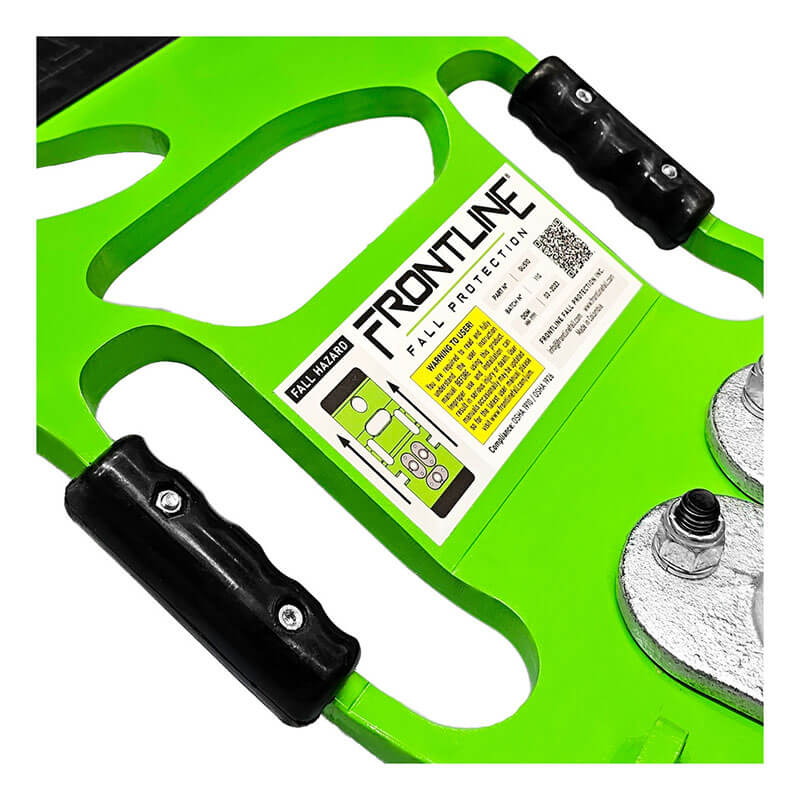 Close-up of a bright green Frontline Guardrails 56 lbs Base GUB56 by Frontline Fall Protection, featuring a label with safety instructions, warning symbols, and two black handles on either side.