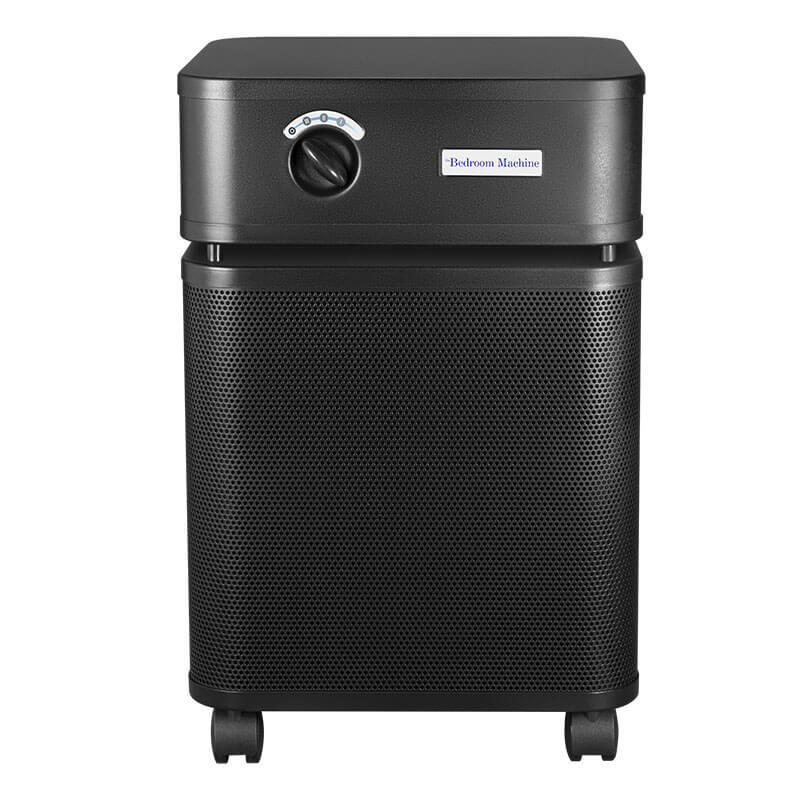 The Austin Air Systems Bedroom Machine B402 is a black air purifier with a control knob, air vents, and four caster wheels featuring a military-grade HEGA filter for advanced filtration.