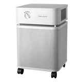The Austin Air Systems Bedroom Machine B402 is a white, box-shaped air purifier with a control dial, side vents, perforated body, four black caster wheels, and advanced HEGA filter technology for superior air purification.