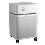The Austin Air Systems Bedroom Machine B402 is a white, box-shaped air purifier with a front control knob, mesh sides, four wheels for mobility, and a medical grade HEPA filter for advanced purification.