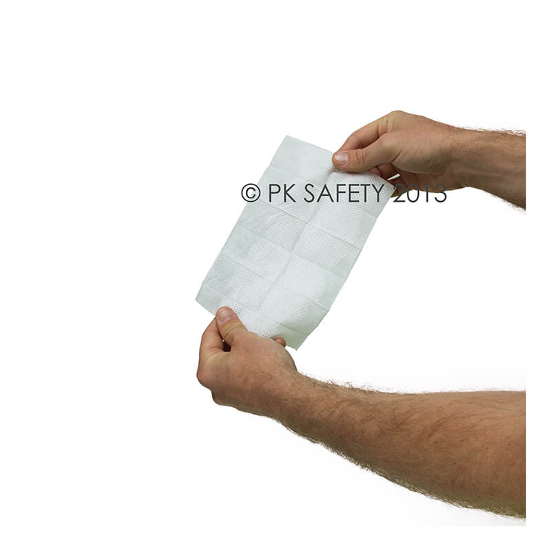 A person holds a rectangular Coretex BugX30 Deet Insect Repellent Towelette against a plain white background.