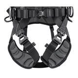 Close-up of the Petzl Volt International Version Harness (C072CB0_) by Petzl in black and gray, featuring adjustable straps, metal buckles, and reinforced stitching—ideal for tower work or use as a fall-arrest harness.