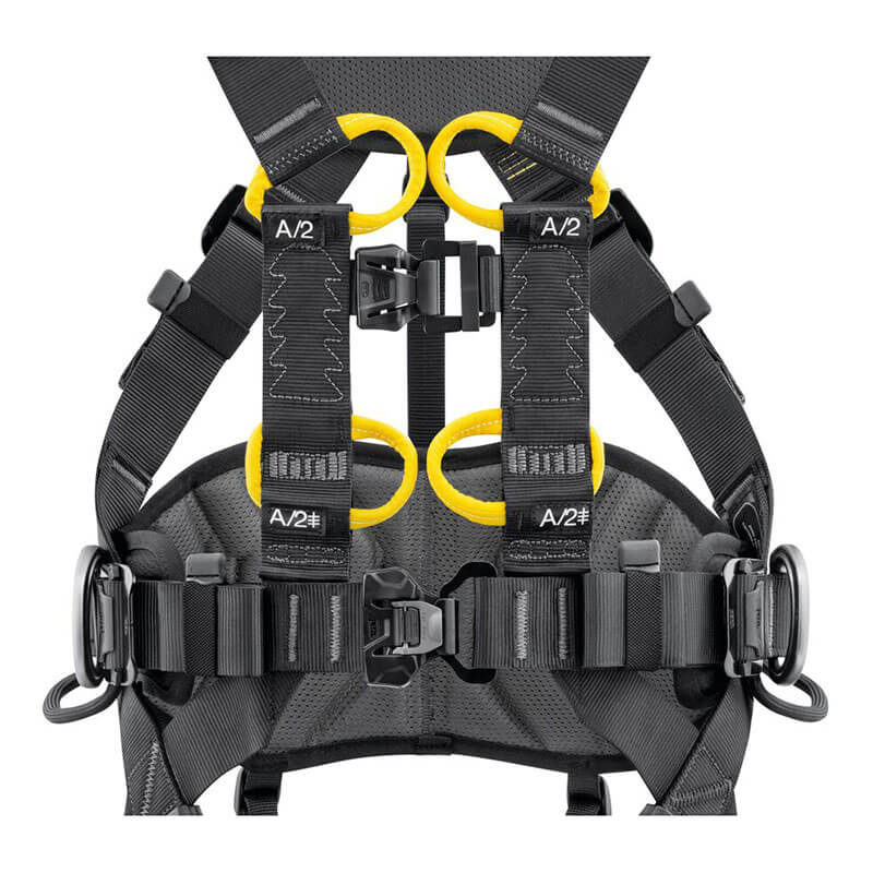 Close-up of the Petzl Volt International Version Harness C072CB0_ by Petzl, featuring a black design with yellow reinforced loops, multiple adjustable straps and buckles for secure attachment during tower work or climbing.