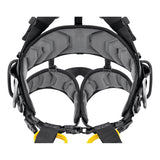 A close-up of the Petzl Volt International Version Harness (C072CB0_), a padded black and gray fall-arrest harness with adjustable straps, metal rings, and buckles by Petzl, designed for secure support and comfort during tower work at height.