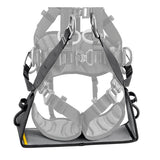The Petzl VOLT International Version Work Seat C072EB00 is a black padded harness accessory by Petzl, designed for work positioning with metal rings and secure straps. The image shows the seat attached in front of a safety harness.