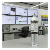 A metal gas cylinder labeled "Gas Compositivo" stands in a modern lab with monitors and equipment—perfect for using the BW Technologies by Honeywell CG-Q34-4 for 4 Gas Monitor Bump Test and Gas Monitor Calibration.