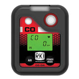 The RKI Instruments CO-04 Series CO(-H2) Single Gas Monitor 73-0067 displays "CO 0 ppm" on its green screen, with "AIR" and "POWER MODE" buttons. This black and red detector is H2 compensated for accurate carbon monoxide readings.