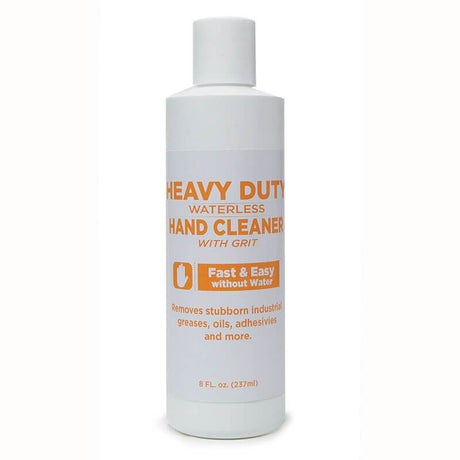 A white bottle of Coretex's Heavy Duty Waterless Hand Cleaner with Grit, featuring orange text, is designed to effectively remove industrial greases, oils, adhesives, and more without the need for water. It is enhanced with scrubbing beads for a deeper clean and contains 8 fl. oz. (237 ml).