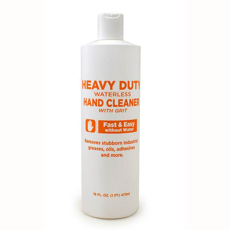 A white bottle of the CoreTex Heavy Duty Waterless Hand Cleaner with Grit, featuring orange text. The label emphasizes "Fast & Easy without Water," and it's designed to effectively remove industrial greases, oils, adhesives, and more. It contains 16 fl. oz. (473 ml).