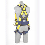 A gray mannequin displays the 3M DBI-SALA Fall Protection Delta Back and Side D-Rings, Belt, Tongue Buckle Construction harness. Ideal for construction applications, this fall protection equipment features yellow and black straps, adjustable buckles, metal D-rings, and a blue padded waist belt. The mannequin is shown from the back view.