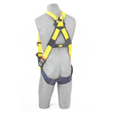 A gray torso mannequin features a 3M DBI-SALA Delta Vest Positioning Safety Harness by 3M DBI-SALA Fall Protection in yellow and black, equipped with corrosion-resistant hardware. The harness includes metal buckles and straps for secure fastening and a durable rear metal ring to enhance fall protection and safety measures.