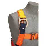 A close-up of a gray mannequin, textured like stone, wearing the 3M DBI-SALA Delta Construction Climbing/Positioning Harness in orange and yellow. The harness features metal buckles and a D-ring on the shoulder strap, highlighting its robust qualities as essential fall protection gear from 3M DBI-SALA Fall Protection.