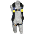 A gray mannequin showcases a 3M DBI-SALA ExoFit XP Comfort Arc Flash Web Loop Rescue Harness, highlighting its black, blue, and yellow straps with metal buckles designed for fall protection. The harness, from the 3M DBI-SALA Fall Protection brand and equipped with comfort padding, is elegantly displayed against a simple white background.