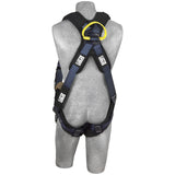 The 3M DBI-SALA ExoFit XP Comfort Arc Flash Web Loop Rescue Harness is gracefully showcased on a grey mannequin. This harness from 3M DBI-SALA Fall Protection features a primarily black and blue design, highlighted by a striking yellow ring at the top. It includes adjustable straps and secure buckles, along with comfort padding for maximum protection during construction or climbing activities.