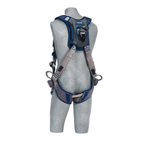 A gray mannequin is showcasing the DBI-SALA ExoFit STRATA Vest-Style Positioning/Climbing Harness by 3M DBI-SALA Fall Protection in gray and blue. It features multiple adjustable straps and loops to ensure a secure, comfortable fit, along with a prominent back panel for dependable attachment.