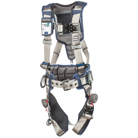 The DBI-SALA ExoFit STRATA Construction Positioning Harness by 3M DBI-SALA Fall Protection showcases blue and gray straps, padded supports, and multiple metal buckles and loops. It features a chest label for easy identification. Engineered for fall safety, this harness provides a secure fit with several adjustment points.