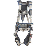 The DBI-SALA ExoFit STRATA Construction Positioning/Climbing Harness by 3M DBI-SALA Fall Protection is designed for fall protection, featuring an advanced weight distribution system. It includes adjustable straps, metal buckles, and padding in a stylish blue and gray design with multiple attachment points for secure construction or climbing activities.