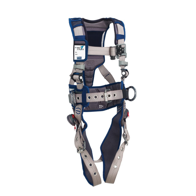 Introducing the 3M DBI-SALA Fall Protection DBI-SALA ExoFit STRATA Construction Positioning Harness, a blue and gray safety harness designed for industrial applications. It features adjustable straps, metal tongue buckles, and padding for enhanced comfort. With its advanced weight distribution system and clearly marked specification tags, this harness offers both safety and convenience.