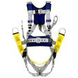 The 3M DBI-SALA ExoFit X100 Comfort Oil & Gas Climbing/Suspension Safety Harness (product code: 140119_) by 3M DBI-SALA Fall Protection features fully adjustable straps and comes in an array of blue, gray, and yellow. It is equipped with multiple clips, buckles, and loops to ensure secure support, making it ideal for use in construction or climbing safety scenarios and essential in the oil and gas industry.