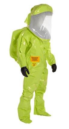 A person is wearing a Dupont Tychem 10000 TK587S HazMat Training Suit, featuring a vibrant green color, transparent face shield, and black gloves. This encapsulated suit is fully protective and inflated, crafted for safely managing hazardous materials or environments.