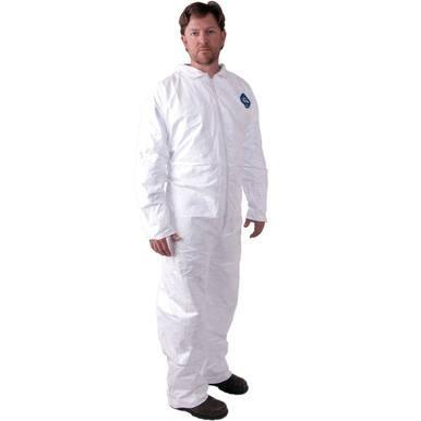 An individual is wearing the DuPont Tyvek 400 HazMat Coverall Suit TY120SVP, which is a long-sleeved white industrial protective coverall with a front zipper. This suit, resembling other Dupont hazmat suits, prominently features the brand's logo on the chest. The person completes their mold remediation gear with dark shoes.