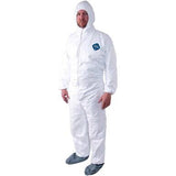 A person is standing upright in a Dupont Tyvek 400 TY122S Coverall Suit, which includes a hood. The suit displays a small blue logo on the chest, and gray shoe covers complete the ensemble against a plain white background.